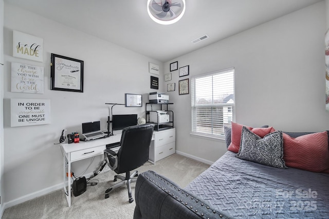 bedroom featuring light carpet, baseboards, and visible vents