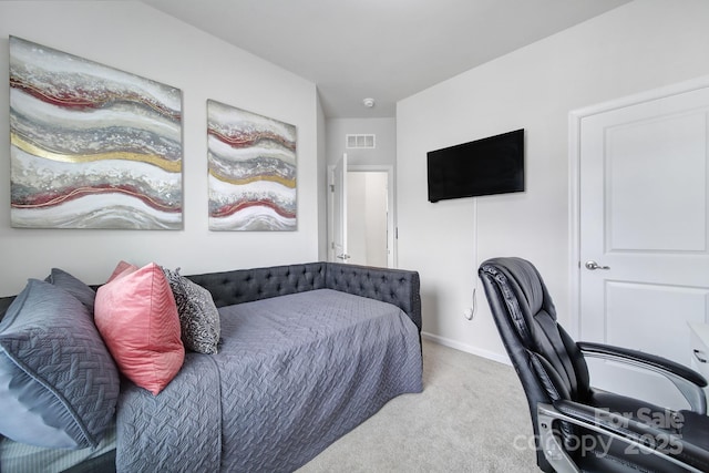 bedroom with carpet floors, visible vents, and baseboards