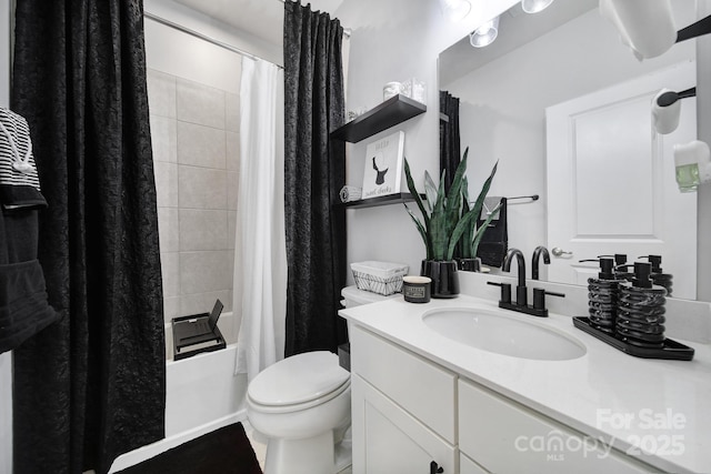 bathroom with vanity, toilet, and shower / tub combo with curtain