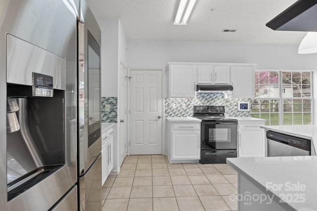 kitchen with under cabinet range hood, visible vents, stainless steel appliances, and light countertops