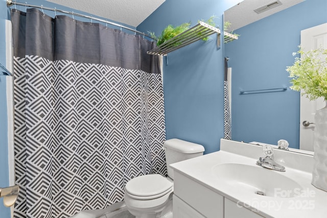 full bath with visible vents, a shower with curtain, toilet, a textured ceiling, and vanity