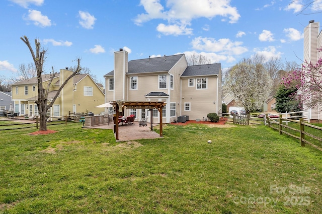 back of house featuring a patio, cooling unit, a fenced backyard, a pergola, and a lawn