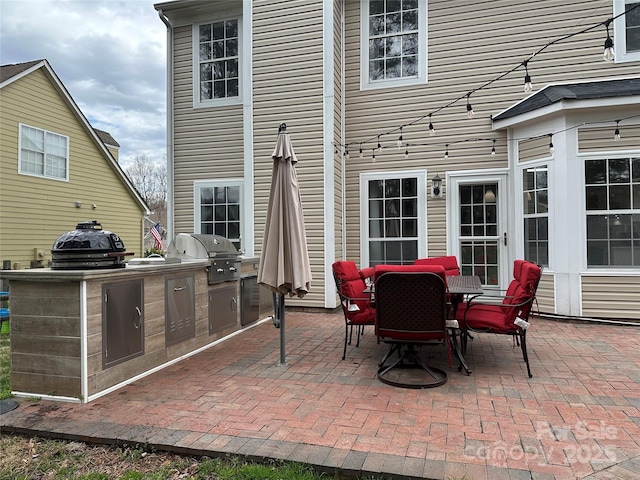 view of patio / terrace with area for grilling and a grill