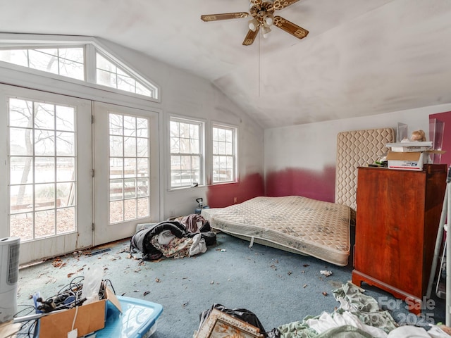 bedroom featuring multiple windows, access to exterior, and vaulted ceiling