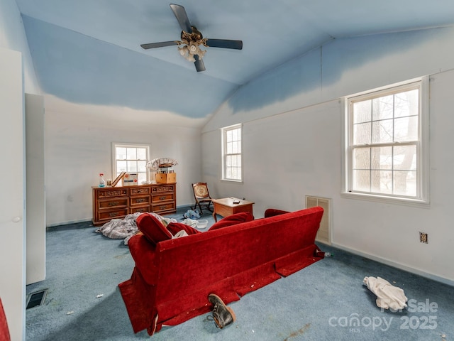 carpeted bedroom with lofted ceiling, baseboards, visible vents, and ceiling fan