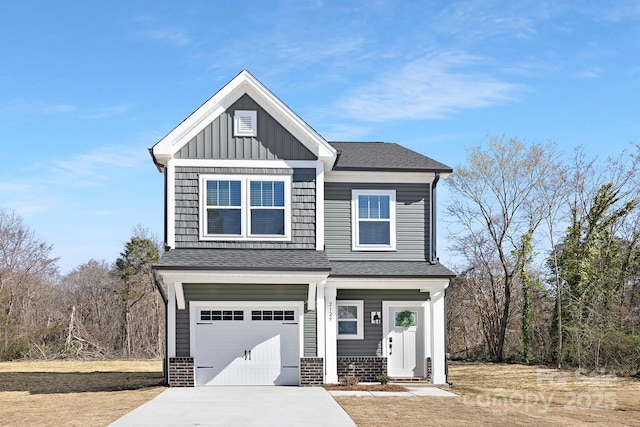 view of front of house featuring a garage, brick siding, board and batten siding, and concrete driveway