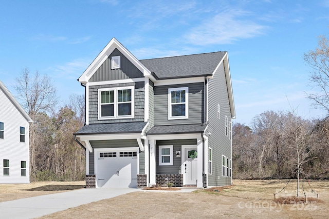 craftsman inspired home featuring a garage, driveway, roof with shingles, board and batten siding, and brick siding