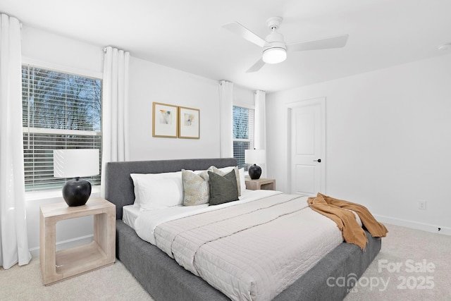 bedroom featuring ceiling fan, baseboards, and carpet flooring