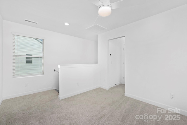 empty room with recessed lighting, baseboards, visible vents, and carpet flooring