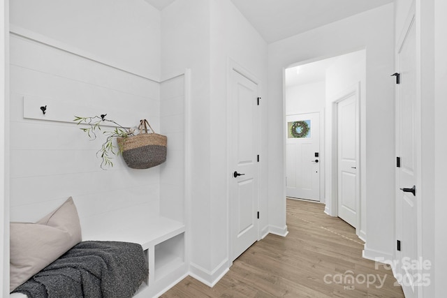 mudroom with light wood finished floors