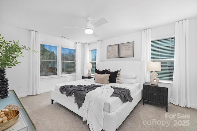 bedroom with a ceiling fan, visible vents, and carpet