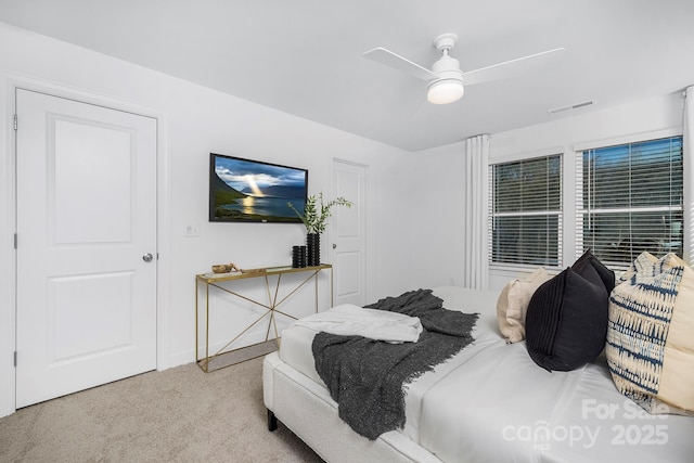 bedroom with visible vents, carpet flooring, baseboards, and ceiling fan