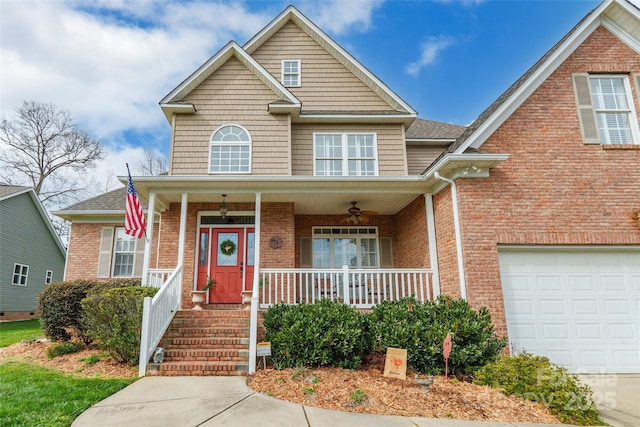 traditional-style home with ceiling fan, a porch, and brick siding