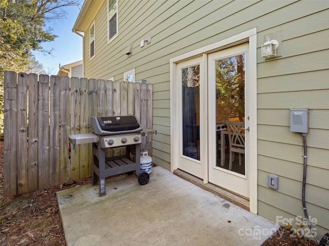 view of patio featuring fence and grilling area