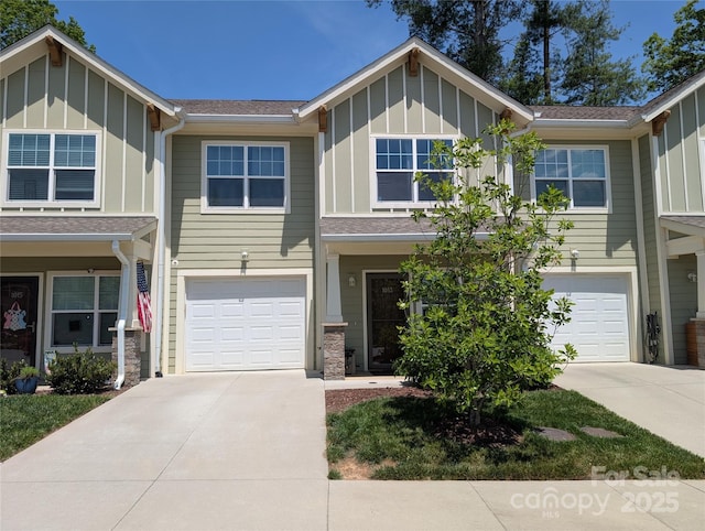 1013 Baldwin Commons Dr, Arden, NC 28704 - view of front of property featuring board and batten siding, concrete driveway, and a garage