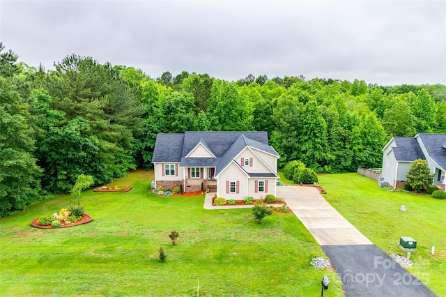 2050 Sunswept Ln, York, SC 29745 - view of front facade with concrete driveway, a front yard, and a wooded view