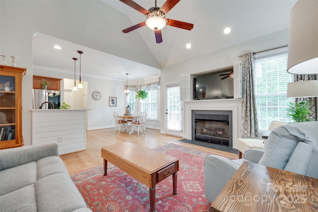 2050 Sunswept Ln, York, SC 29745 - living area featuring ceiling fan, vaulted ceiling, light wood finished floors, recessed lighting, and a fireplace with flush hearth