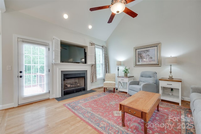 2050 Sunswept Ln, York, SC 29745 - living room featuring ceiling fan, a fireplace with flush hearth, wood finished floors, high vaulted ceiling, and baseboards