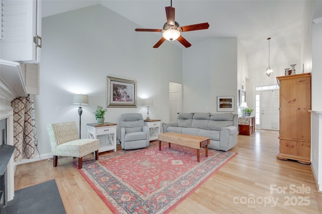 2050 Sunswept Ln, York, SC 29745 - living area featuring high vaulted ceiling, a fireplace, light wood-type flooring, a ceiling fan, and baseboards