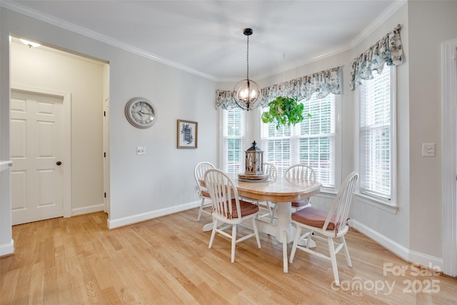 2050 Sunswept Ln, York, SC 29745 - dining room with light wood finished floors, baseboards, a chandelier, healthy amount of natural light, and ornamental molding