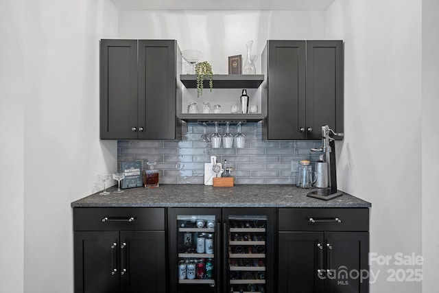 bar with a dry bar, wine cooler, and tasteful backsplash