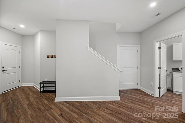 entryway with recessed lighting, dark wood-style flooring, visible vents, and baseboards