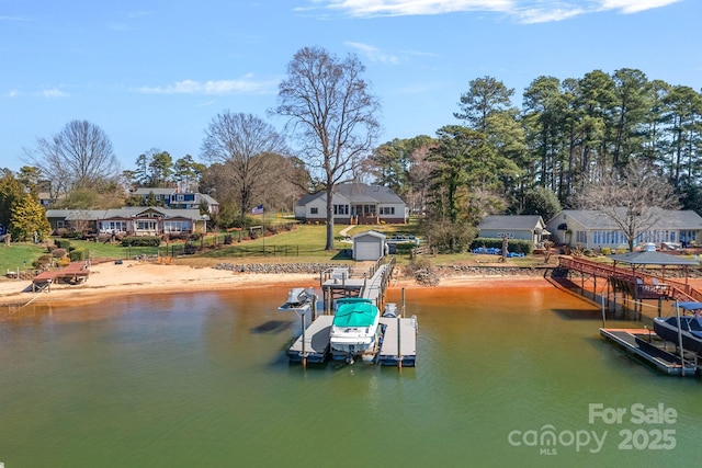 view of dock featuring a residential view, a water view, fence, and boat lift