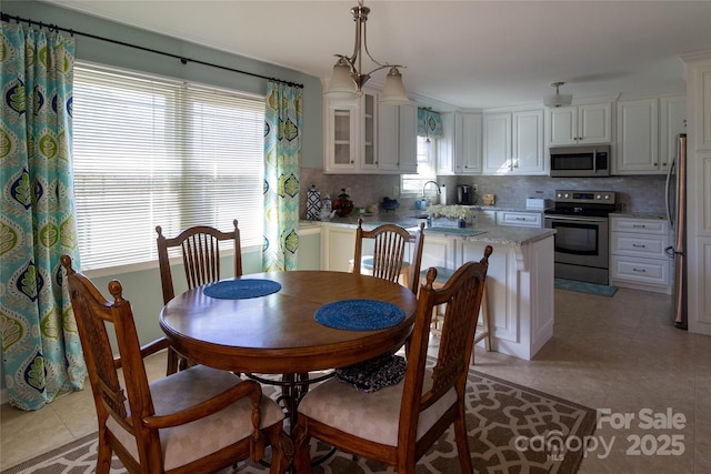 dining room with light tile patterned flooring