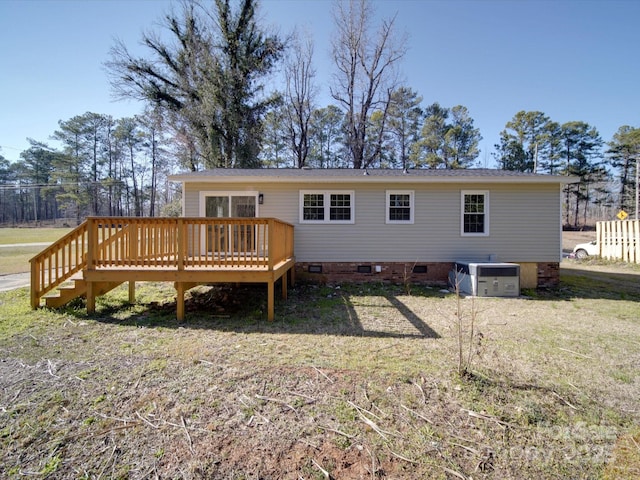 back of house featuring crawl space, central air condition unit, and a wooden deck