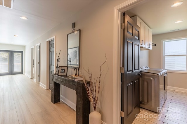 hallway with baseboards, french doors, visible vents, and recessed lighting