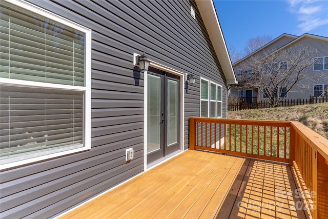 wooden deck with french doors and fence