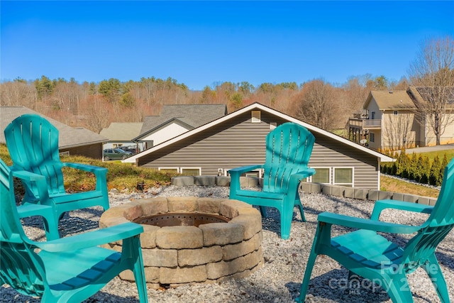 view of side of home with a fire pit