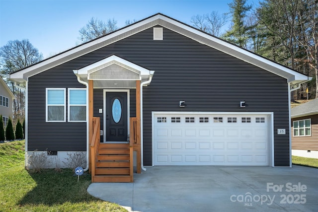 view of front of home with crawl space, driveway, and an attached garage