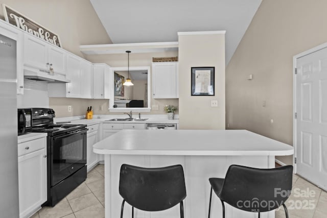 kitchen with under cabinet range hood, electric range, a sink, white cabinetry, and a kitchen bar