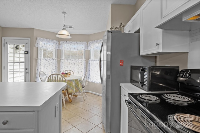 kitchen featuring light tile patterned floors, ventilation hood, a textured ceiling, light countertops, and black appliances