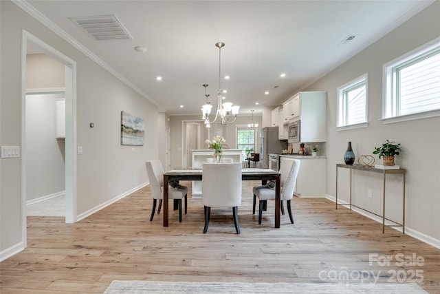4521 Middlebury Ln, Fort Mill, SC 29715 - dining room featuring a chandelier, ornamental molding, light wood-style flooring, and recessed lighting