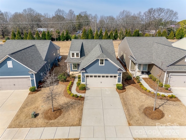 4521 Middlebury Ln, Fort Mill, SC 29715 - view of front of home featuring driveway, roof with shingles, and a garage