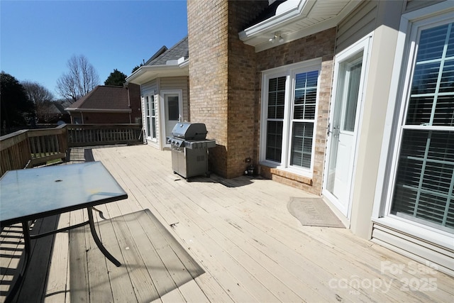 wooden deck with area for grilling