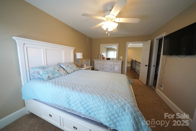 carpeted bedroom featuring baseboards and a ceiling fan