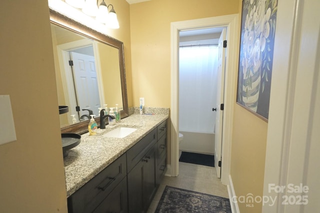 full bathroom featuring a washtub, walk in shower, vanity, and toilet