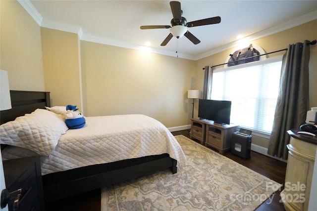 bedroom with ornamental molding, dark wood-style flooring, and baseboards