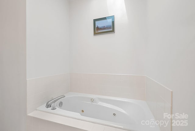 full bathroom featuring a jetted tub