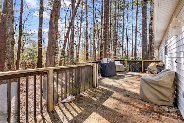 wooden terrace featuring grilling area