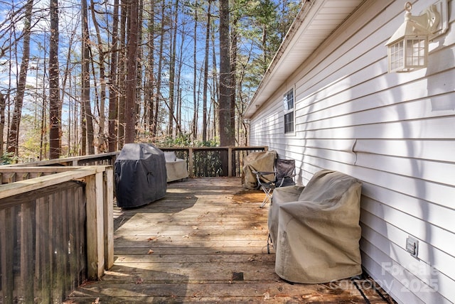 deck featuring a grill