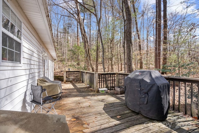 wooden deck featuring grilling area