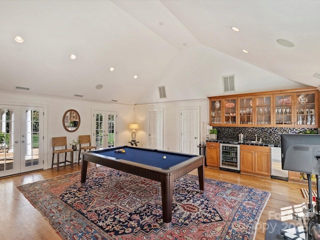 playroom with french doors, wine cooler, light wood-type flooring, and visible vents