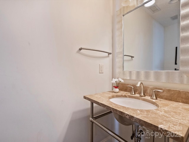 bathroom with visible vents and a sink