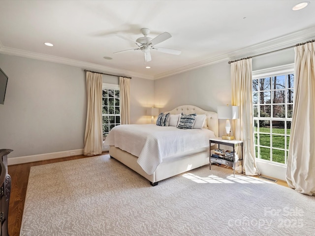 bedroom featuring recessed lighting, wood finished floors, a ceiling fan, baseboards, and crown molding