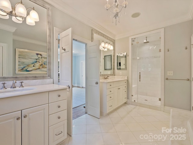 bathroom featuring crown molding, a notable chandelier, a sink, and a shower stall