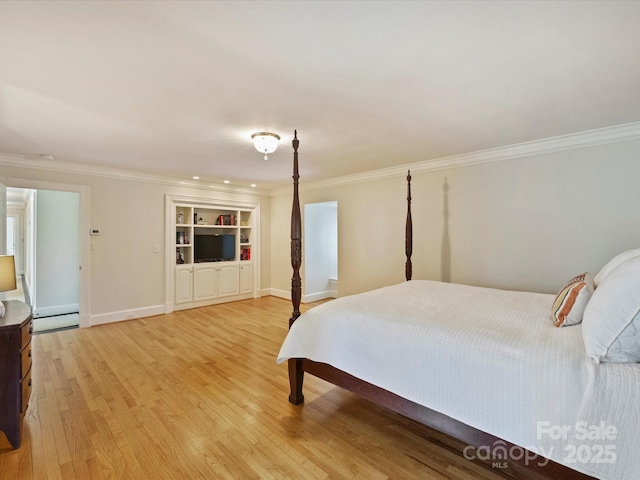 bedroom featuring ornamental molding, a baseboard radiator, light wood-style flooring, and baseboards